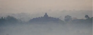 Sunrise at Setumbu Hill and Borobudur Temple, and Merapi Volcano
